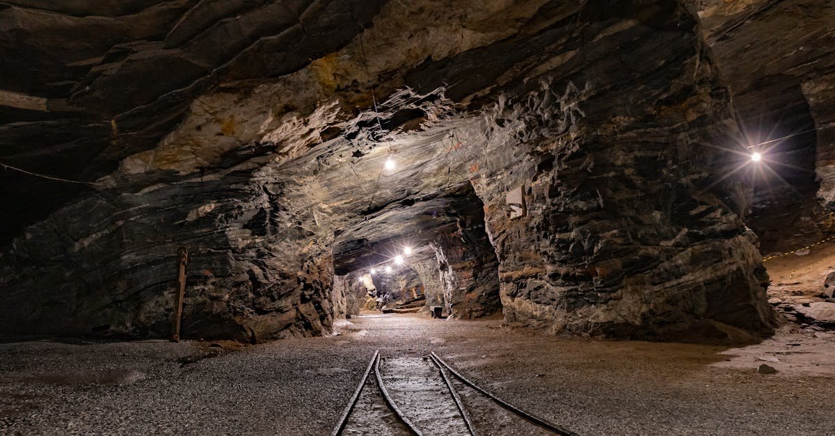 Explore the mysterious depths of Passagem de Mariana, MG, Brazil, with this illuminated underground mine tunnel.